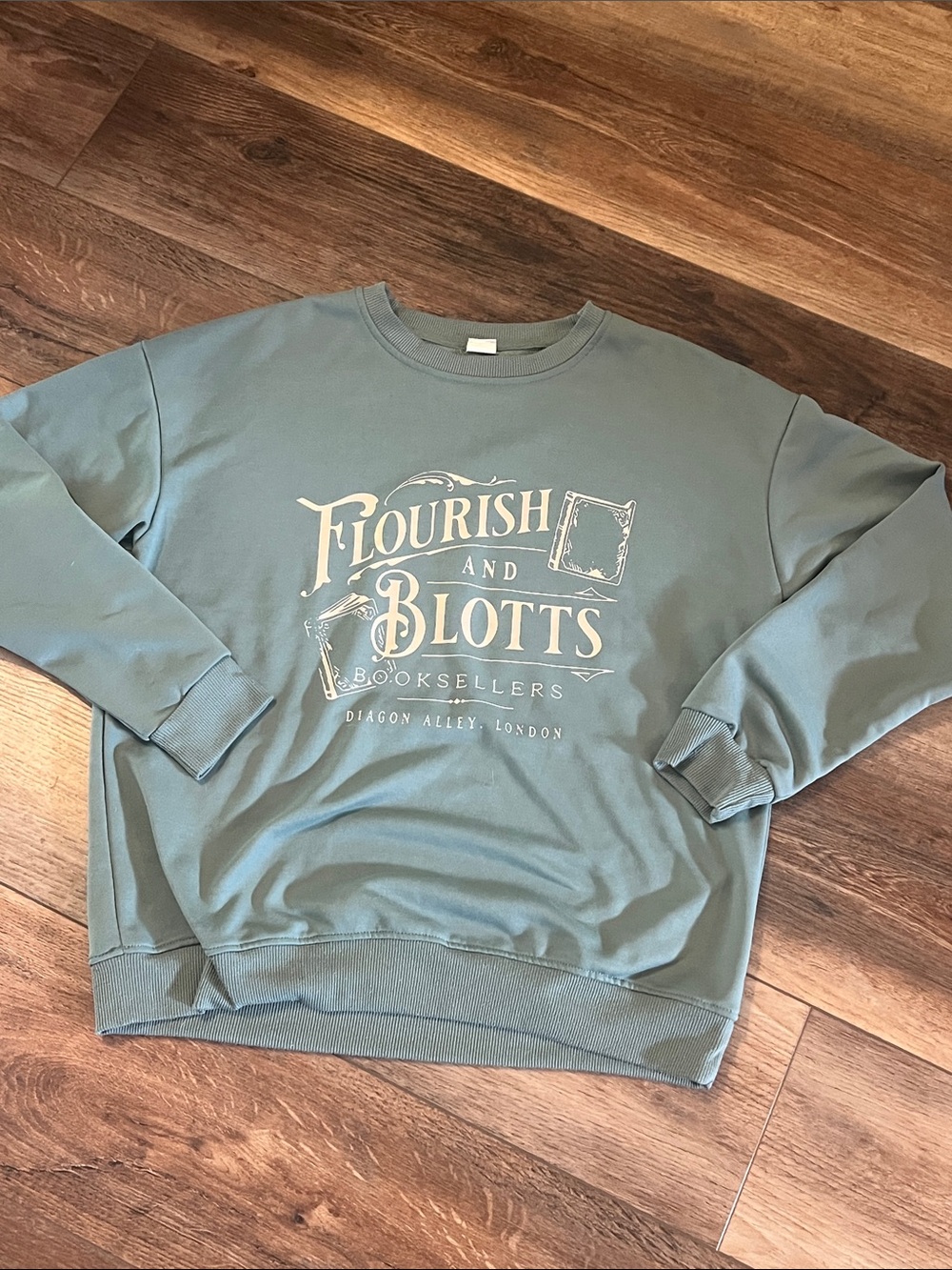 S Harry Potter Flourish and Blotts Graphic Crewneck Sweatshirt- Sage Green
